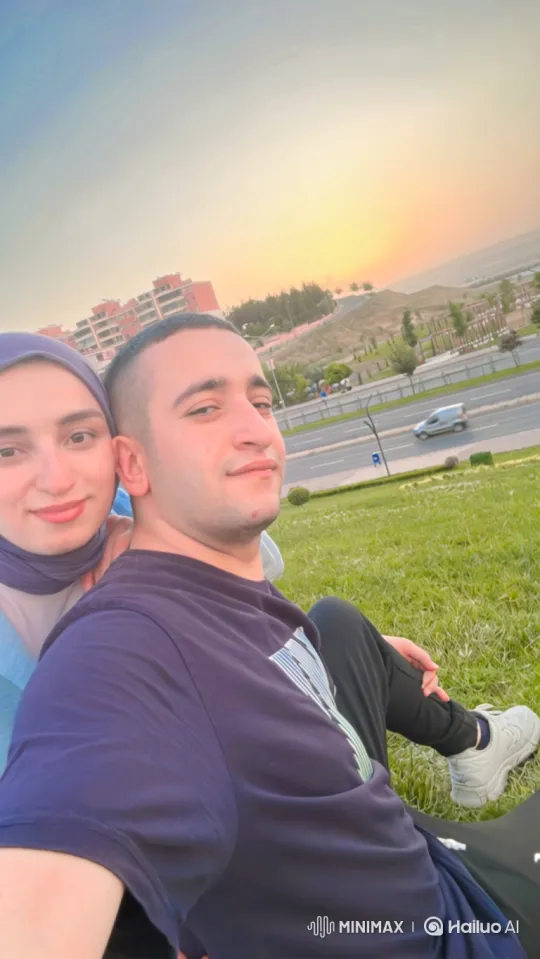 Family Embraces on Grassy Hill at Dusk – AI Generated Video | Hailuo AI