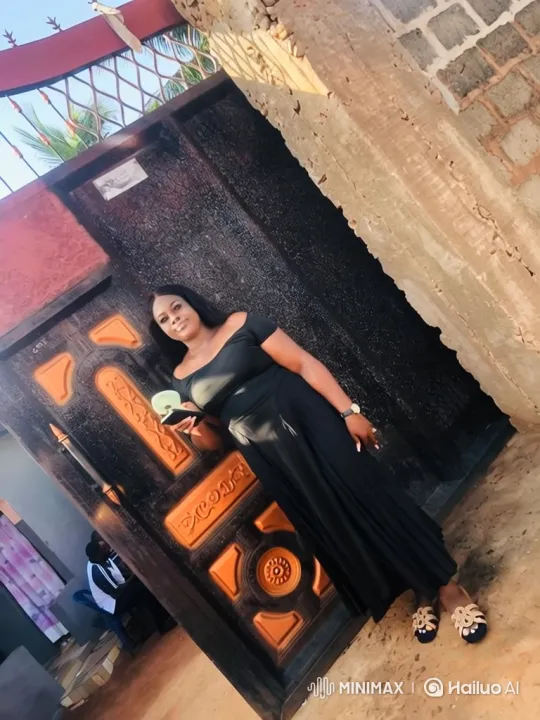 Woman in Black Dress Poses with Warm Smile – AI Generated Video | Hailuo AI