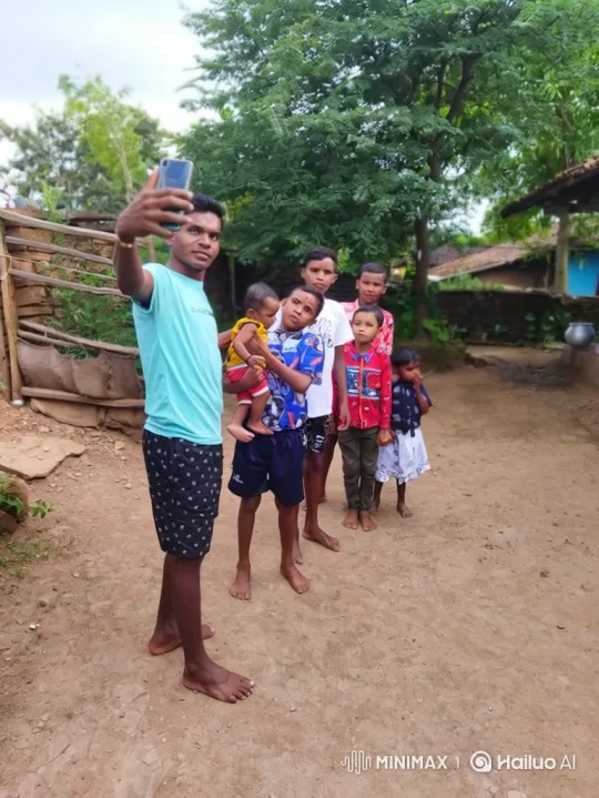 Young Man and Children Take Selfie in Rural Village – AI Generated Video | Hailuo AI