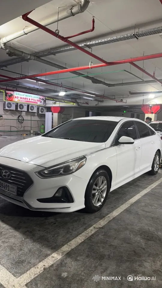 White Sedan Lowering in Underground Parking Garage – AI Generated Video | Hailuo AI