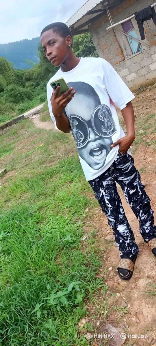 Young Man Reflects on a Dirt Path with Smartphone – AI Generated Video | Hailuo AI