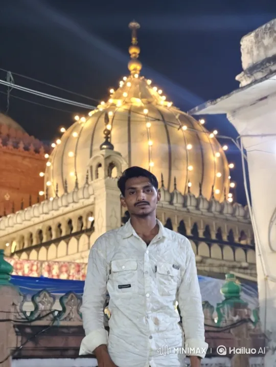 Young Man in Front of Illuminated Dome Building – AI Generated Video | Hailuo AI