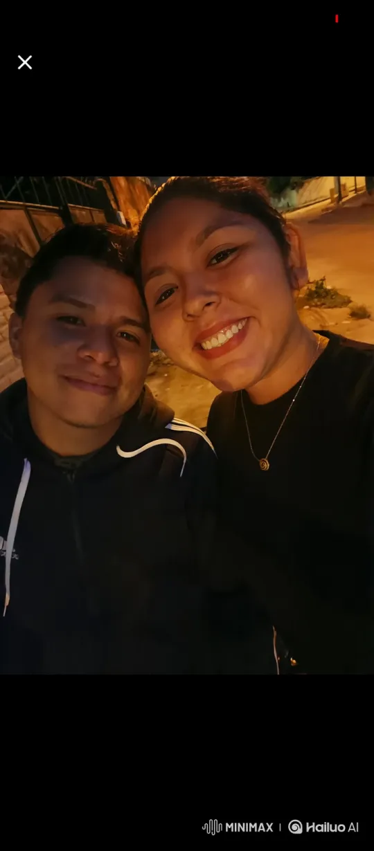 Family Embrace Captured in Night's Gentle Glow – AI Generated Video | Hailuo AI
