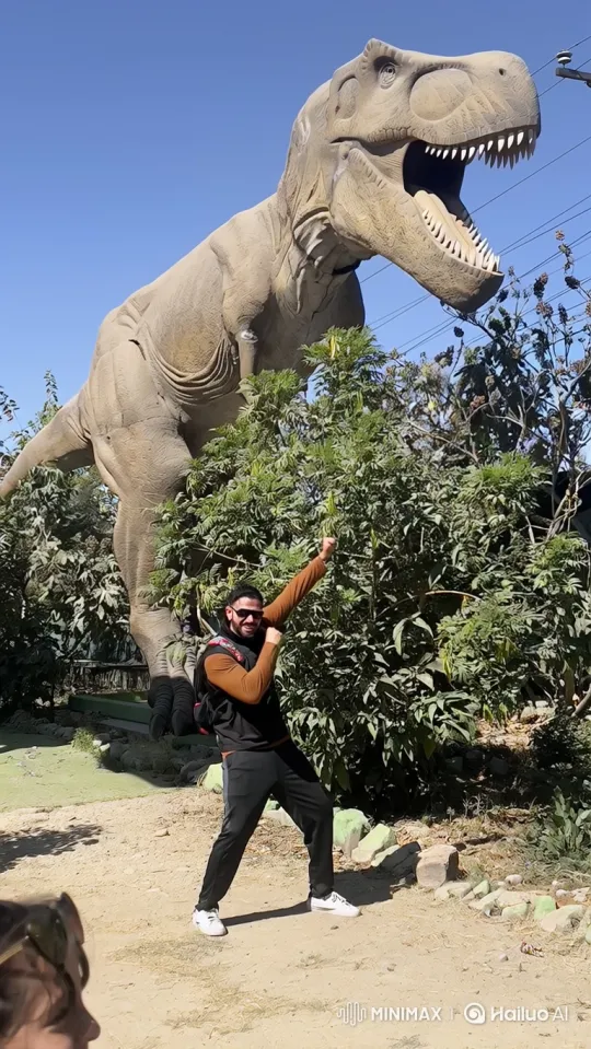 Man Playfully Swallowed by Animatronic T-Rex Statue – AI Generated Video | Hailuo AI