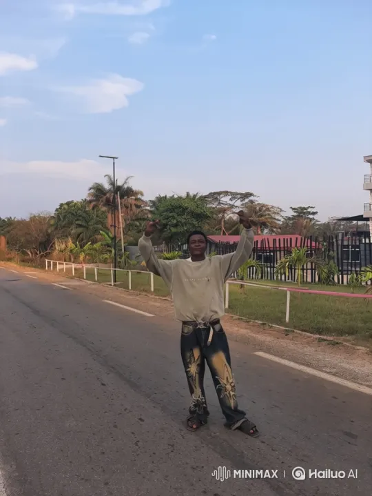 Young Man Celebrates on Paved Road – AI Generated Video | Hailuo AI