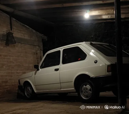 Vintage Hatchback Lowers with Air Suspension in Carport – AI Generated Video | Hailuo AI