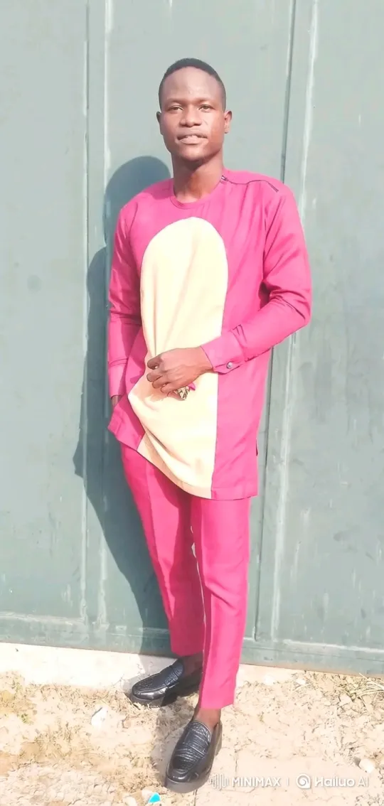 Fashionable Man Poses in Magenta Outfit with Gentle Movements – AI Generated Video | Hailuo AI