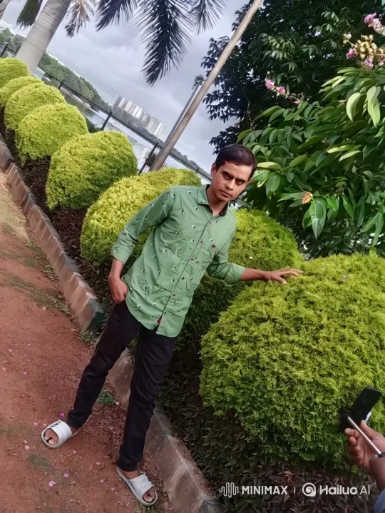 Young Man Poses in Park, Captured on Video – AI Generated Video | Hailuo AI