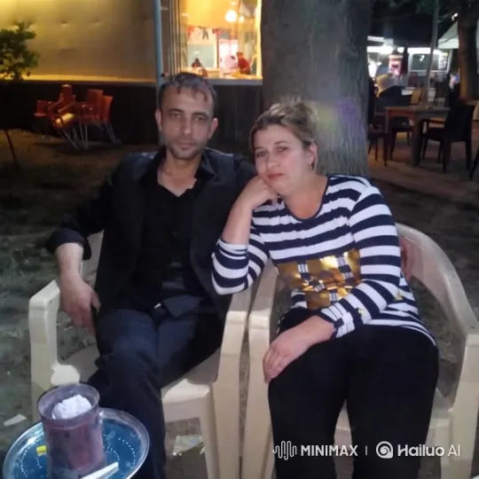 Family Embrace at Outdoor Cafe Captured in Video – AI Generated Video | Hailuo AI
