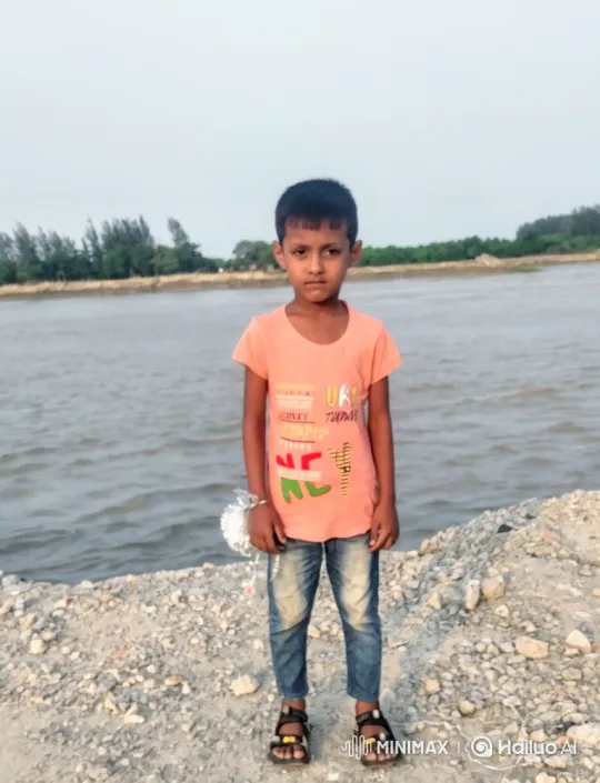 Boy Stands Calmly by River, Holding Sparkly Object – AI Generated Video | Hailuo AI