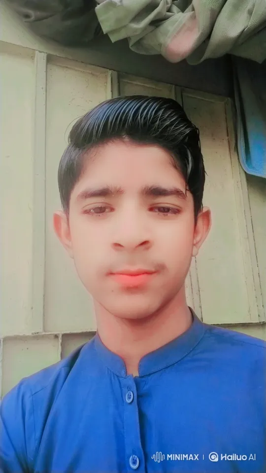 Young Man in Blue Shirt Maintains Gentle Smile – AI Generated Video | Hailuo AI