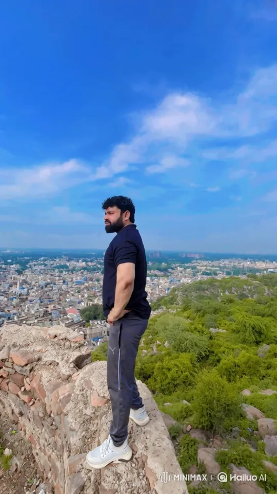 Man on Cliff Contemplates City, Ascends to Cosmic Perspective – AI Generated Video | Hailuo AI