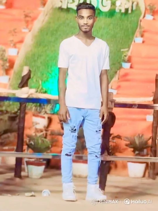 Young Man in White Tee Smiles Gently Amidst Colorful Backdrop – AI Generated Video | Hailuo AI