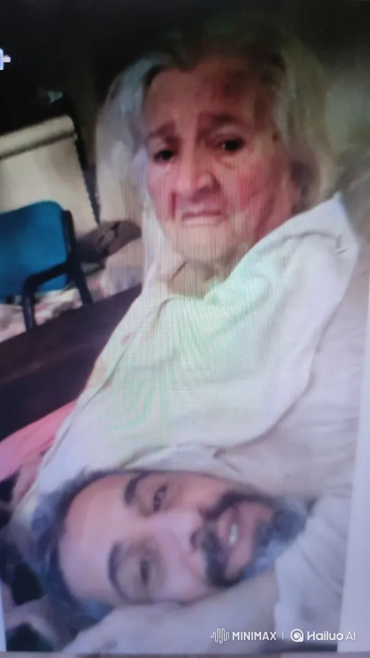 Elderly Woman Comforts Smiling Man in Intimate Moment – AI Generated Video | Hailuo AI
