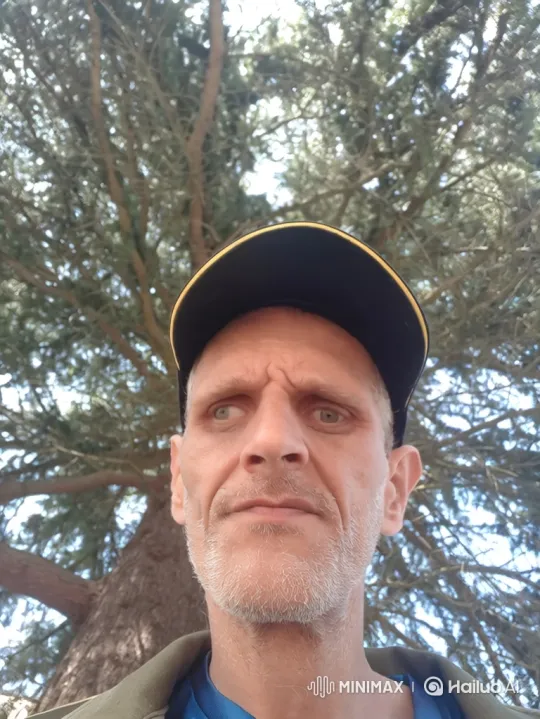Concerned Man Surrounded by Rapidly Growing Cannabis Plants – AI Generated Video | Hailuo AI