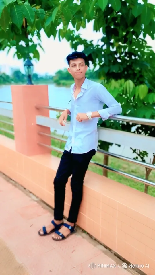 Young Man in Casual Attire on Walkway by Water – AI Generated Video | Hailuo AI