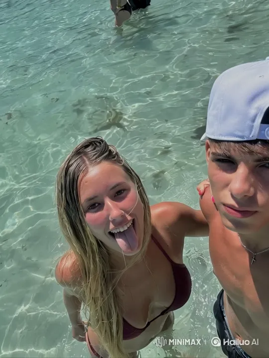 Family Portrait: Couple and Daughter in Beach Water – AI Generated Video | Hailuo AI