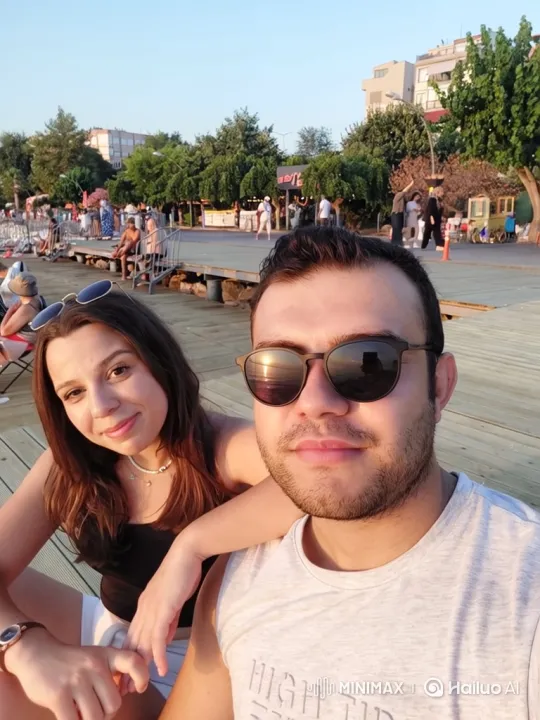 Family Embrace on a Summer Evening Boardwalk – AI Generated Video | Hailuo AI