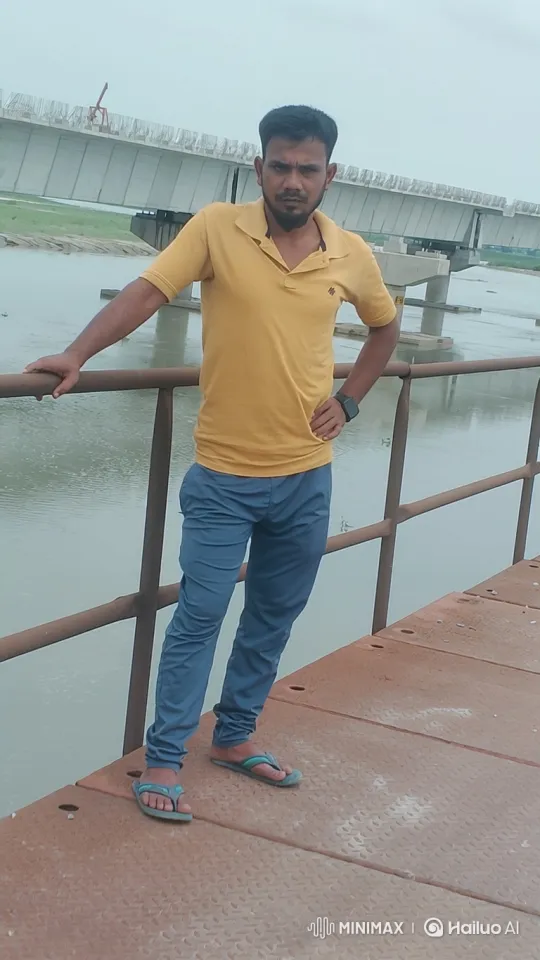 Man Stands on Walkway Observing River, Bridge Under Construction – AI Generated Video | Hailuo AI