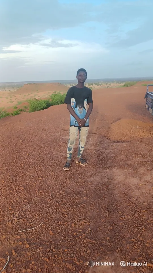 Young Man Contemplates in Vast Arid Landscape – AI Generated Video | Hailuo AI