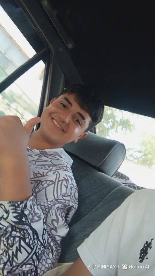 Teenage Boy's Joyful Thumbs-Up During Family Drive – AI Generated Video | Hailuo AI