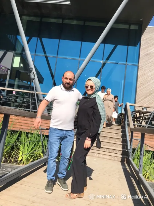 Couple and Child Embrace on Modern Walkway – AI Generated Video | Hailuo AI