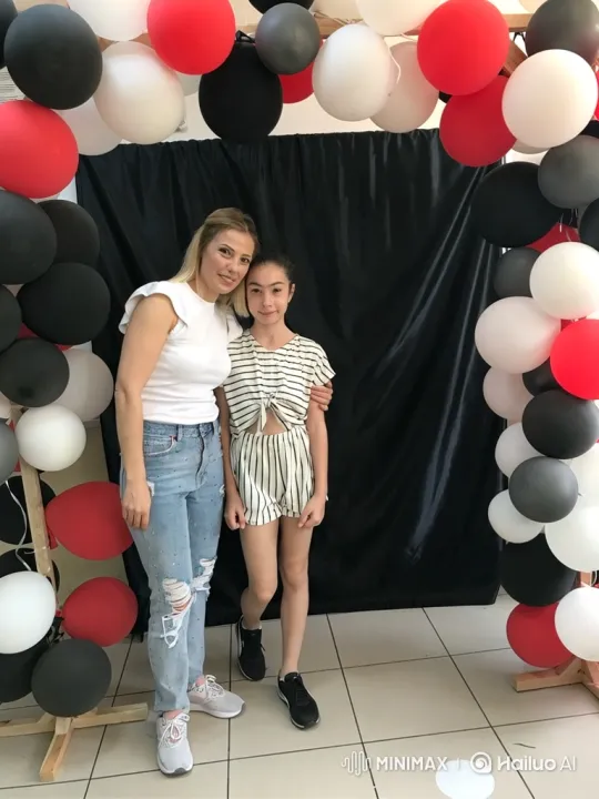 Woman and Girl Embrace in Festive Setting – AI Generated Video | Hailuo AI