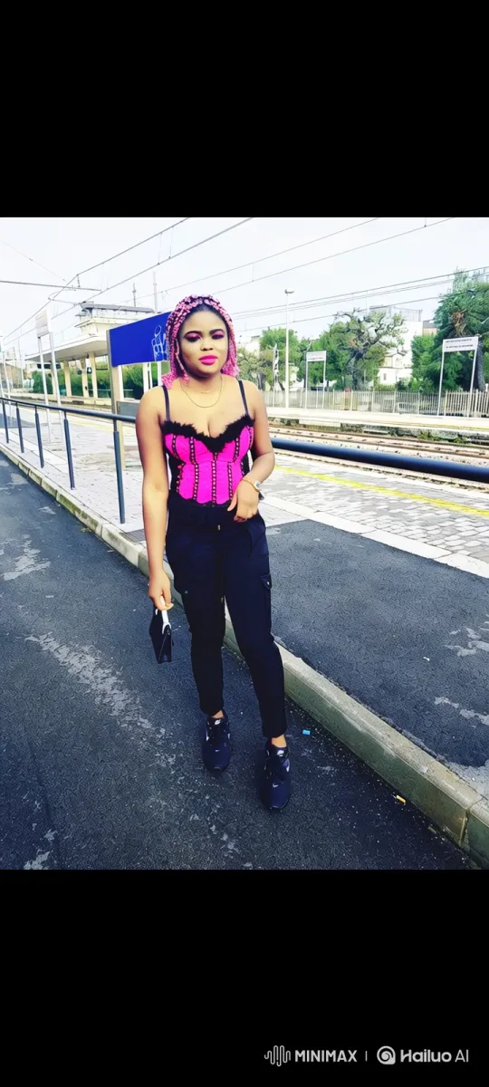 Stylish Woman with Pink Braids Boards Red Car at Train Station – AI Generated Video | Hailuo AI