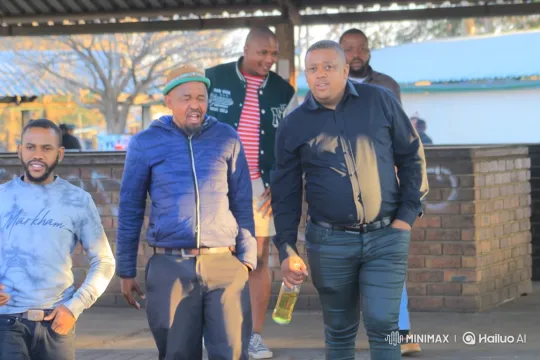 Five Men Chatting Under a Pavilion on a Sunny Day – AI Generated Video | Hailuo AI