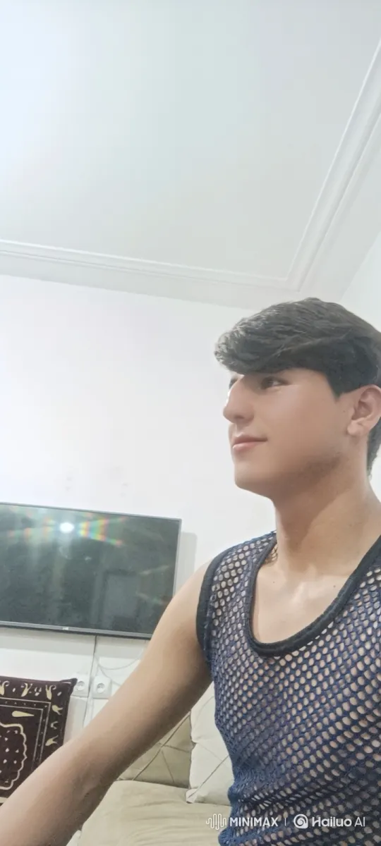 Young Man on Couch: A Moment of Serenity – AI Generated Video | Hailuo AI