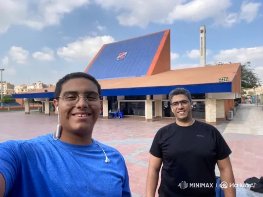 Two Men Stroll and Chat Across Plaza – AI Generated Video | Hailuo AI
