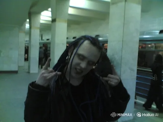 Cybergoth Person Unfurls Wings on Subway Platform – AI Generated Video | Hailuo AI
