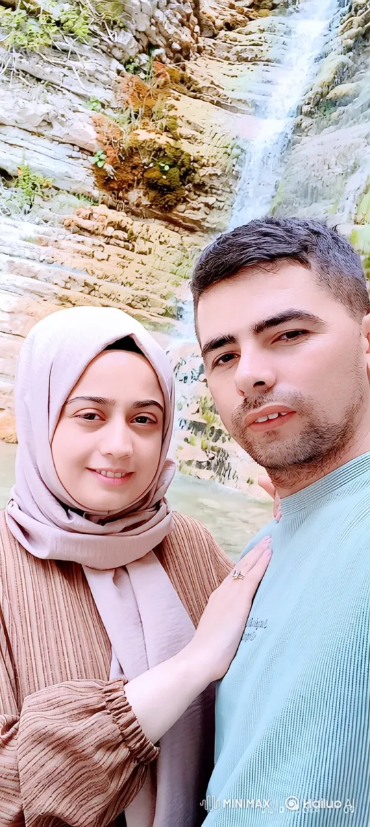 Family Portrait: Couple and Child Embrace by Waterfall – AI Generated Video | Hailuo AI