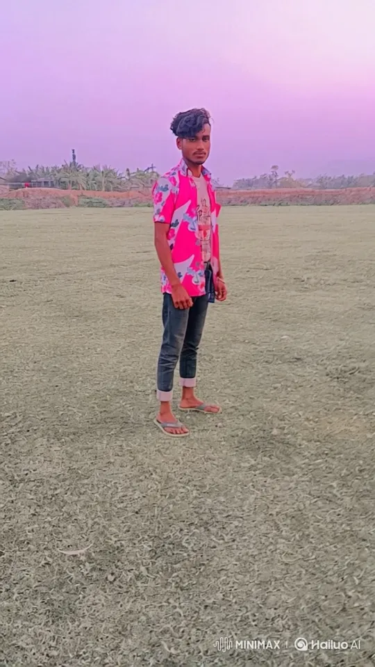 Young Man Contemplates in Vast Field Under Hazy Sky – AI Generated Video | Hailuo AI