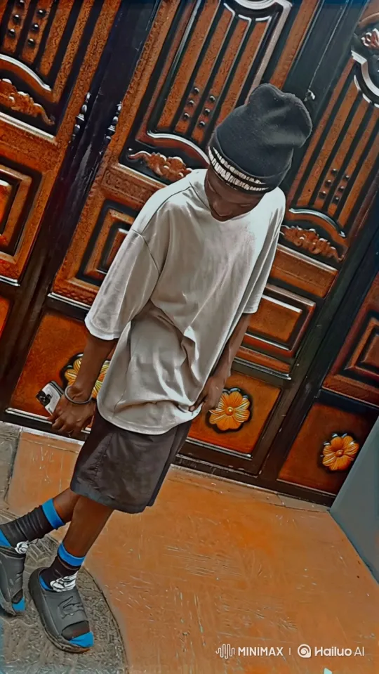 Young Person in Casual Attire Standing Thoughtfully – AI Generated Video | Hailuo AI