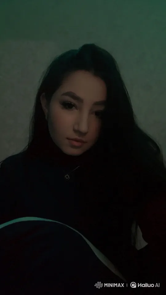 Young Woman Blows a Kiss in a Dimly Lit Room – AI Generated Video | Hailuo AI