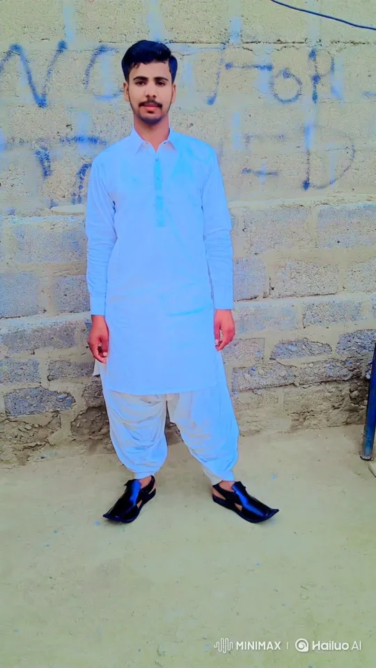 Young Man in Traditional Attire Stands Still, Shifts Gaze – AI Generated Video | Hailuo AI