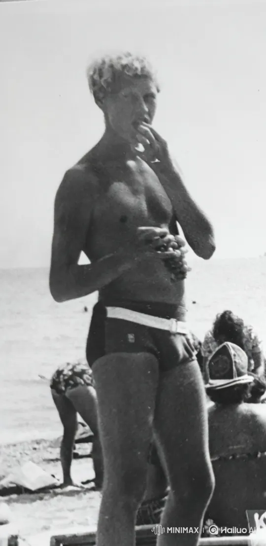 Young Man Eating Grapes on a Beach - Complex Tracking Shot – AI Generated Video | Hailuo AI