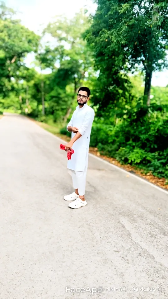 Young Man in White Clothing Walks Down Paved Road – AI Generated Video | Hailuo AI