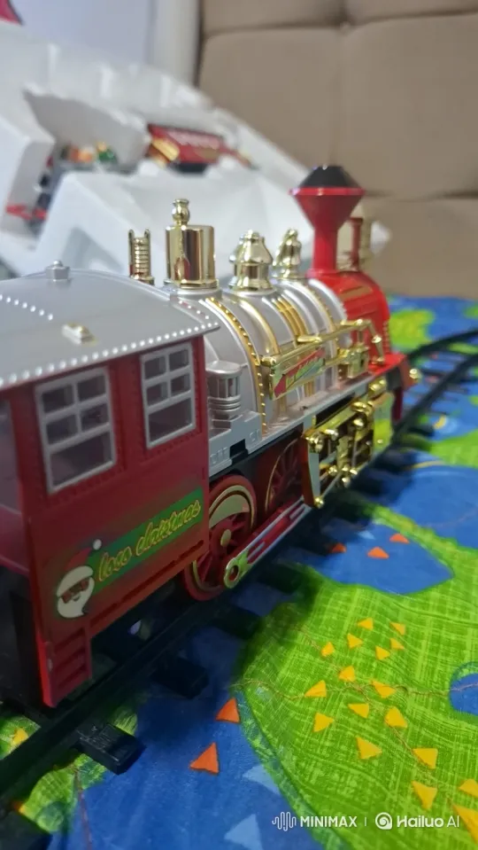 Toy Train's Festive Journey on a Patterned Blanket – AI Generated Video | Hailuo AI