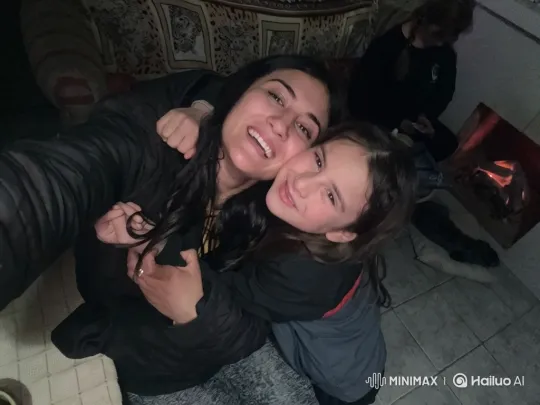 Family Embraces in Cozy Room by the Fire – AI Generated Video | Hailuo AI