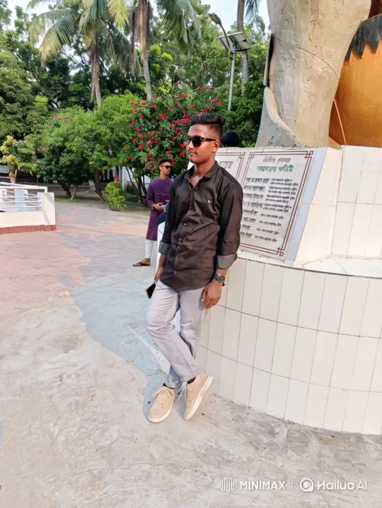 Young Man in Park Interacts with Calm Environment – AI Generated Video | Hailuo AI