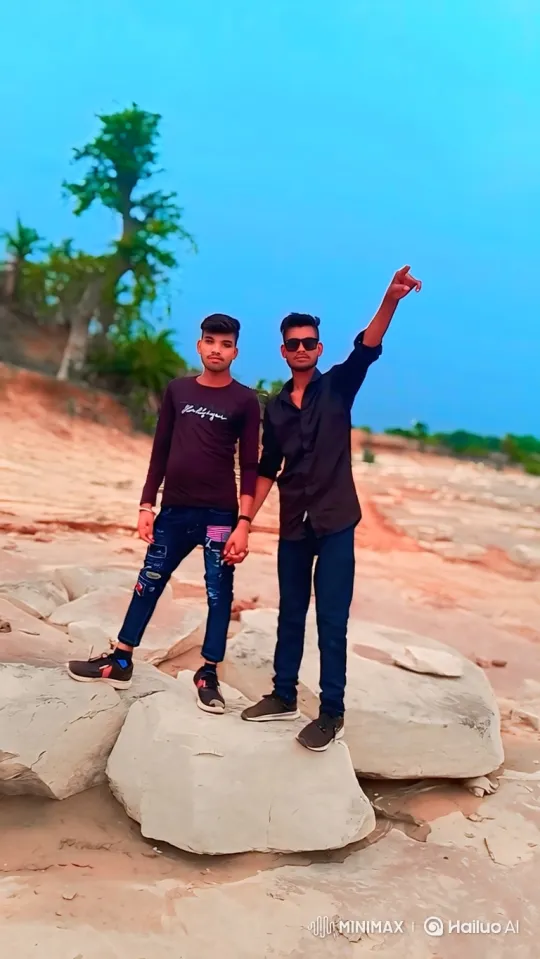 Two Men Pose on Rocks in Serene Landscape – AI Generated Video | Hailuo AI