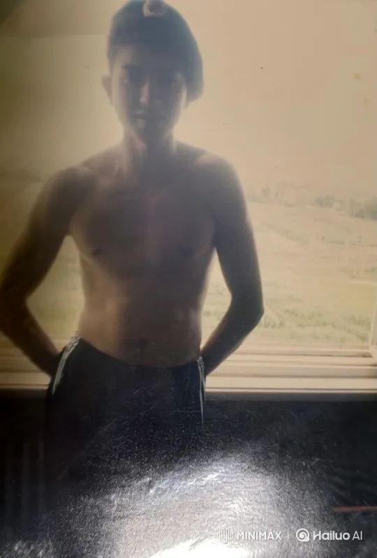 Young Man Contemplates Outdoors in Vintage Nostalgia – AI Generated Video | Hailuo AI