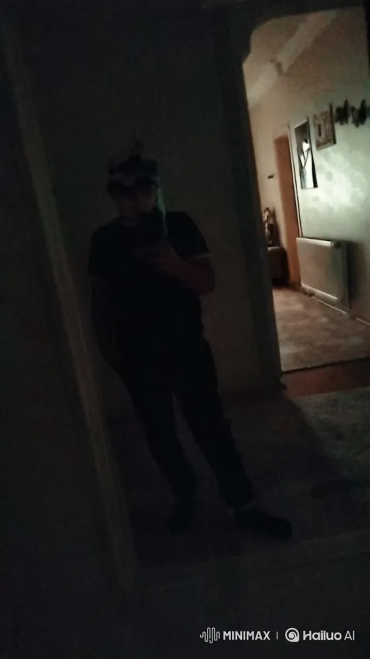Dim Hallway Selfie: Shadowy Pose and Quiet Mood – AI Generated Video | Hailuo AI