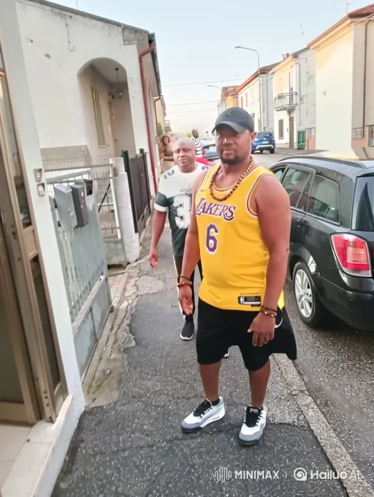 Two Men Step Forward in a Quiet Town Street – AI Generated Video | Hailuo AI