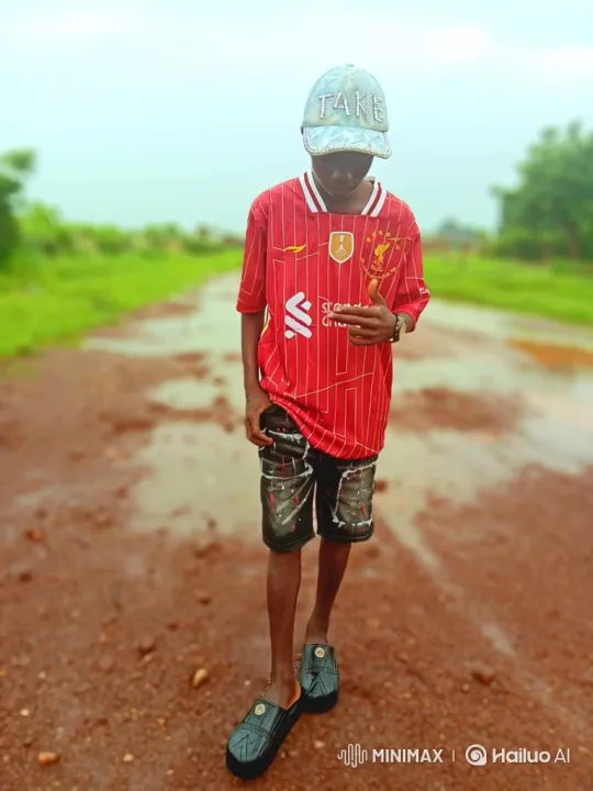 Young Man in Football Jersey on Dirt Road – AI Generated Video | Hailuo AI
