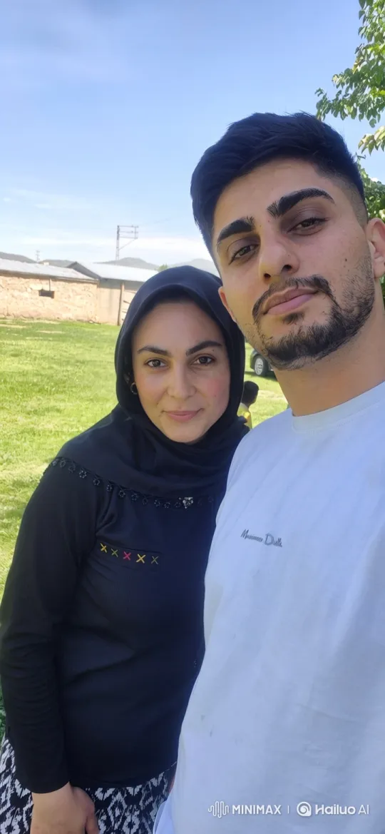 Family Moment Captured on Video: Couple and Daughter's Loving Embrace – AI Generated Video | Hailuo AI