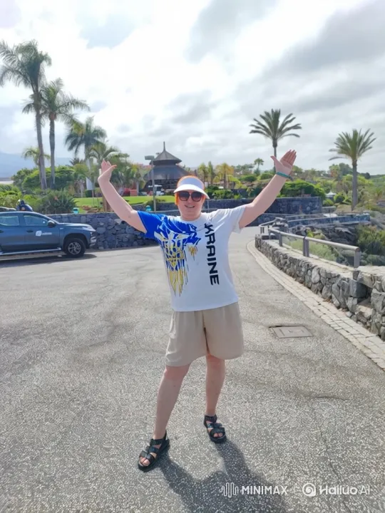 Celebratory Person in Ukraine Shirt Amidst Lush Palm Trees – AI Generated Video | Hailuo AI