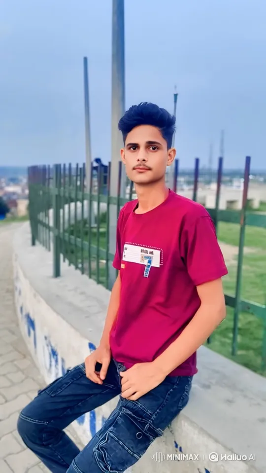 Young Man in Casual Pose Against Wall with Gentle Smile – AI Generated Video | Hailuo AI